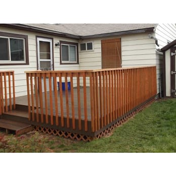 Blue Creek Construction - a deck with railings - General Contractors Near Me