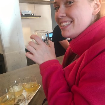 Wise Bird Cider - Jennifer enjoying a house cider flight - Cideries Near Me - Lexington, Kentucky Wise Bird Cider - Jennifer enjoying a house cider flight - Cideries Near Me - Lexington, Kentucky