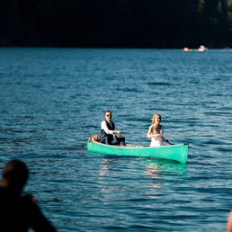 Bride and Groom in a canoe at NatureBridge Olympic on Lake Crescent in Olympic National Park Bride and Groom in a canoe at NatureBridge Olympic on Lake Crescent in Olympic National Park