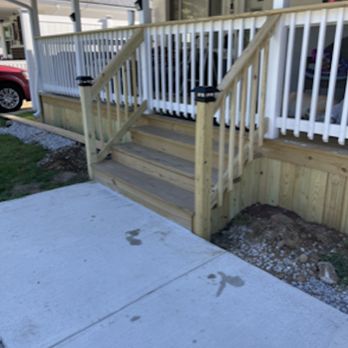Built at Home Services - a front porch with steps and railings - General Contractors Near Me