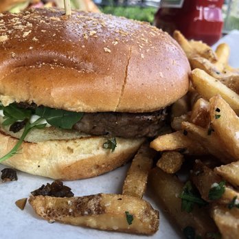 Yard House - Lamb burger with goat cheese and arugula with a side of garlic truffle fries. - New American Near Me - Orlando, Florida Yard House - Lamb burger with goat cheese and arugula with a side of garlic truffle fries. - New American Near Me - Orlando, Florida
