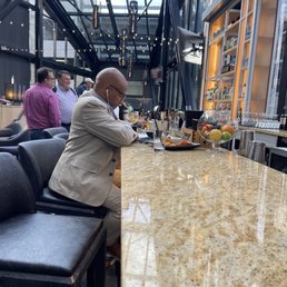 a man sitting at a bar a man sitting at a bar