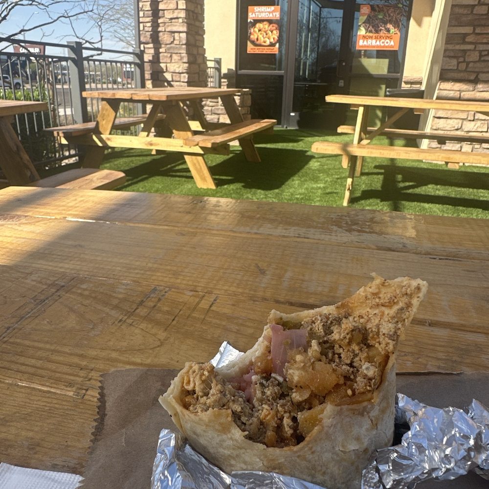 A mostly eaten chorizo breakfast burrito because I couldn't wait. A mostly eaten chorizo breakfast burrito because I couldn't wait.