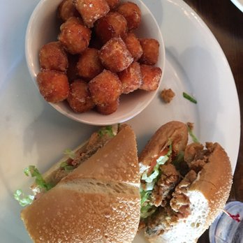 Ricos World Kitchen - Oyster poboy with sweet potato tater tots - New American Near Me - Buford, Georgia Ricos World Kitchen - Oyster poboy with sweet potato tater tots - New American Near Me - Buford, Georgia