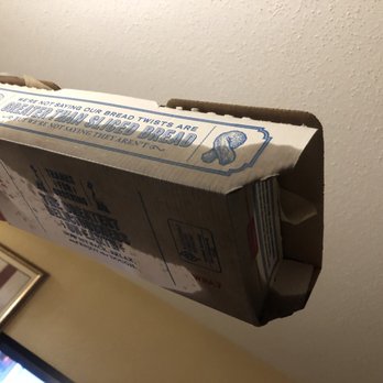 Domino's Pizza - a hand holding a pizza box - Chicken Wings Near Me - Manning, South Carolina Domino's Pizza - a hand holding a pizza box - Chicken Wings Near Me - Manning, South Carolina
