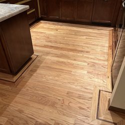 Van Patten Hardwood Services - Kitchen with walnut detail border.