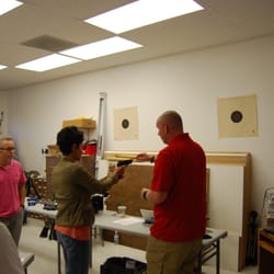 Shooting Made Fun - Firearms Instructor John Buchanok teaching proper grip during the Basic Handgun Course.