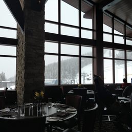 a dining room with a view of the mountains a dining room with a view of the mountains