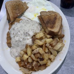 Johnny D’s Family Restaurant - Chicken fried steak,eggs,hash browns and toast.