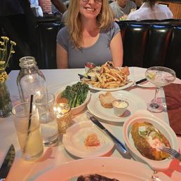 Ribeye, baked potato, broccolini, fish and chips, Tom collins, Midori sour