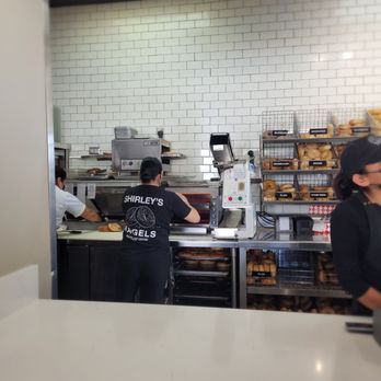 Shirley's Bagels - Employees working in a way to make sandwiches as quick as they're ordered. - Bagels Near Me - Costa Mesa, California Shirley's Bagels - Employees working in a way to make sandwiches as quick as they're ordered. - Bagels Near Me - Costa Mesa, California