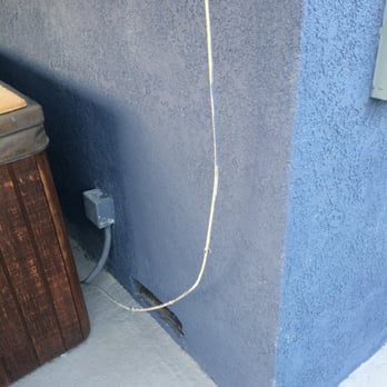 B C Construction - A dangling cord, left for weeks and weeks after stucco was complete. Also note thin paint coverage. - General Contractors Near Me - Long Beach, California