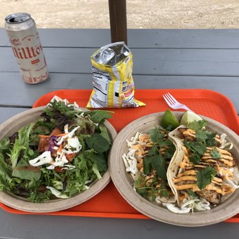Monhegan Fish House - two plates of food on a picnic table - Seafood Markets Near Me - Monhegan, Maine Monhegan Fish House - two plates of food on a picnic table - Seafood Markets Near Me - Monhegan, Maine