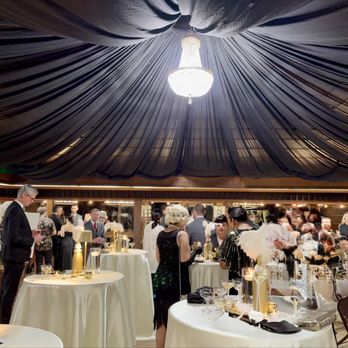 Fun Sky Party Rentals - Black drapery, stunning chandelier, satin linens with bistro tables. - Party Equipment Rentals Near Me - Newark, California Fun Sky Party Rentals - Black drapery, stunning chandelier, satin linens with bistro tables. - Party Equipment Rentals Near Me - Newark, California