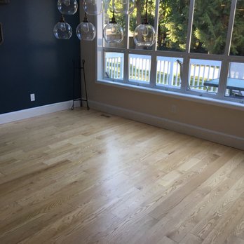 Mythical Hardwood Floors - a room with a large window - Flooring Near Me Mythical Hardwood Floors - a room with a large window - Flooring Near Me