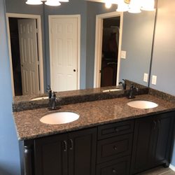 Carpet Tile & Flooring - Cabinet and granite installed with a new mirror and flooring