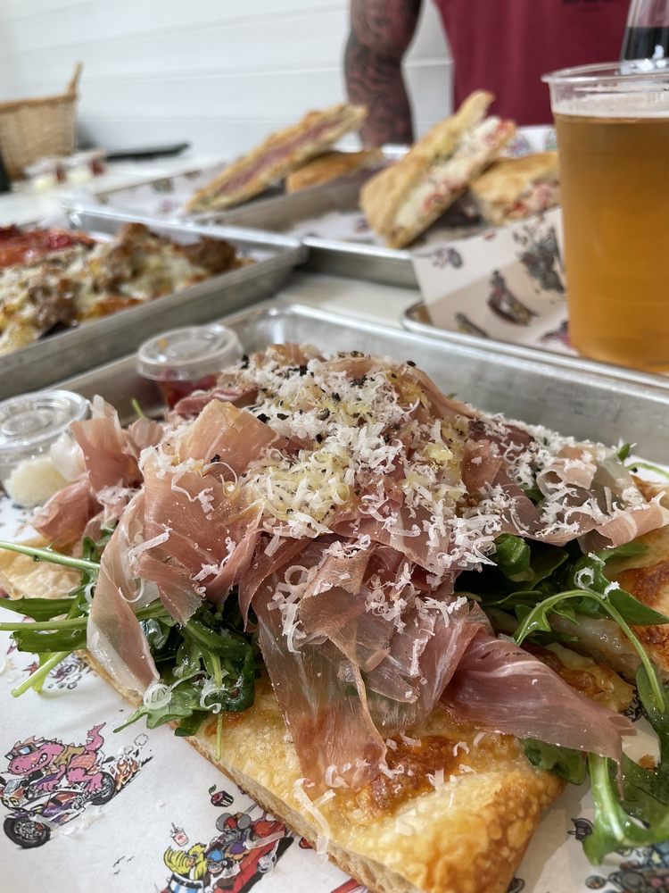 Arugula prosciutto pizza slice Yelp