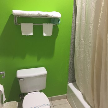 Camelot Inn & Suites - Nice lime green restroom with sanitized toilet. - Hotels Near Me - Houston, Texas Camelot Inn & Suites - Nice lime green restroom with sanitized toilet. - Hotels Near Me - Houston, Texas