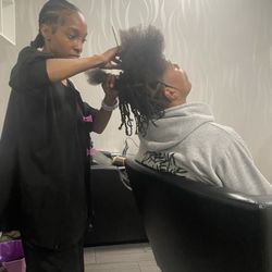 Denine Defined Beauty Boutique - My nephew Kendale getting two strand twist from an amazing stylist