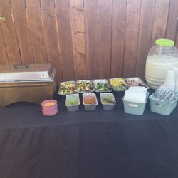 Taquizas Y Carnitas Los Compadres - The sides, rice and beans in the chargers.