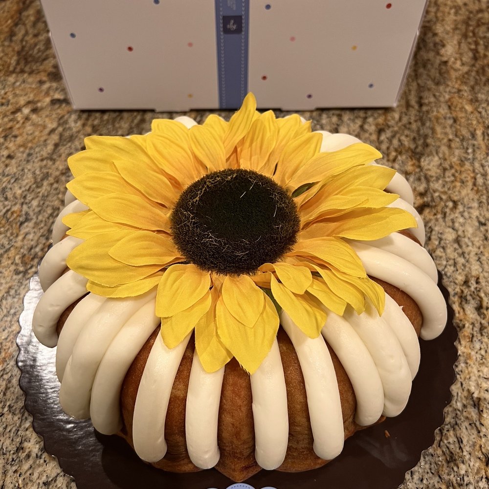 Nothing Bundt Cakes - 10" white chocolate raspberry (it's a $7 charge to add the sunflower, fyi) - Bakeries Near Me - Gilbert, Arizona