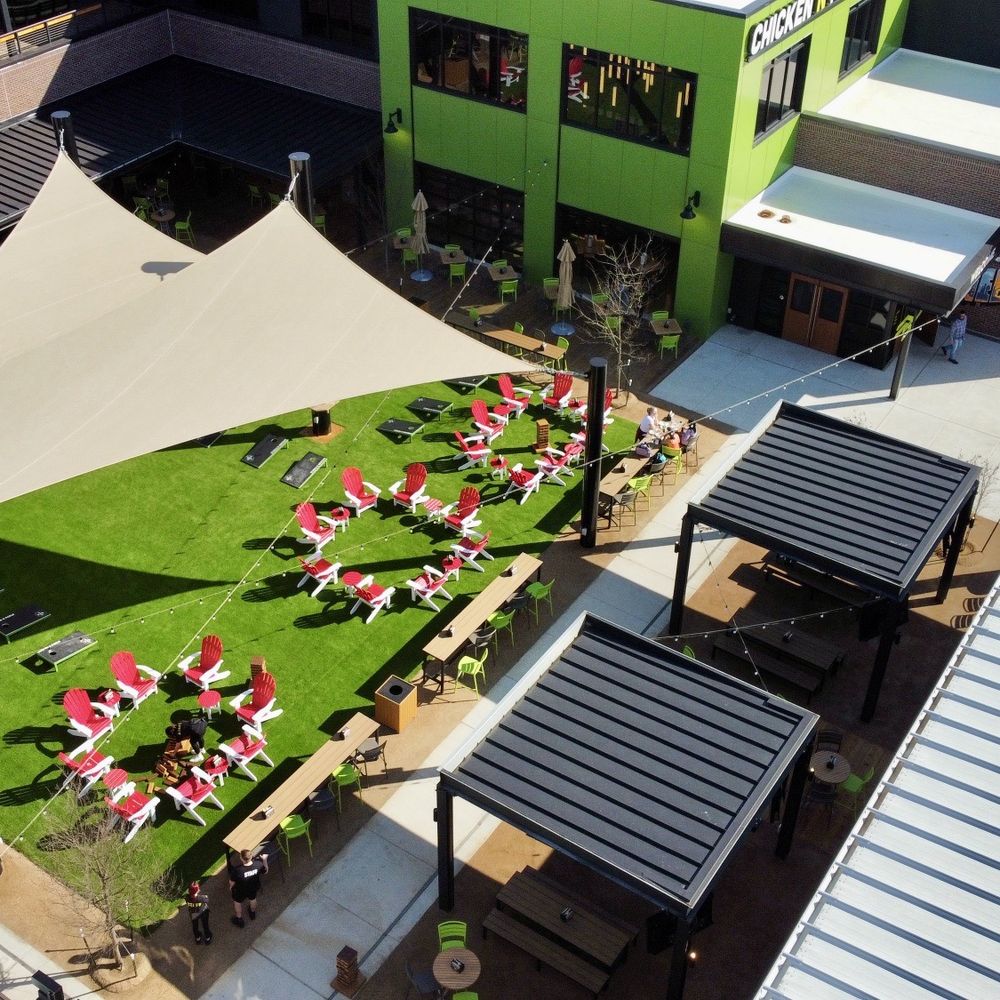 Drone view of the outdoor seating area of Chicken & Pickle