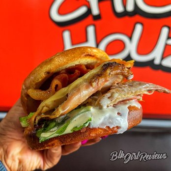 Chick Houz - a hand holding a sandwich - Chicken Shop Near Me - Houston, Texas