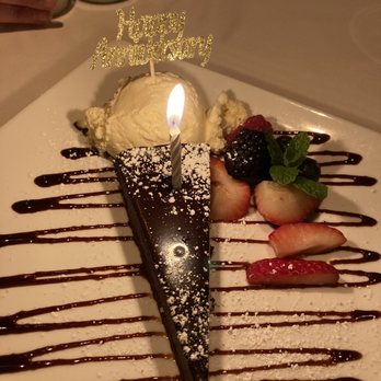 Arnold Palmer's Restaurant - Anniversary flourless chocolate cake with assorted berries - American Near Me - La Quinta, California Arnold Palmer's Restaurant - Anniversary flourless chocolate cake with assorted berries - American Near Me - La Quinta, California