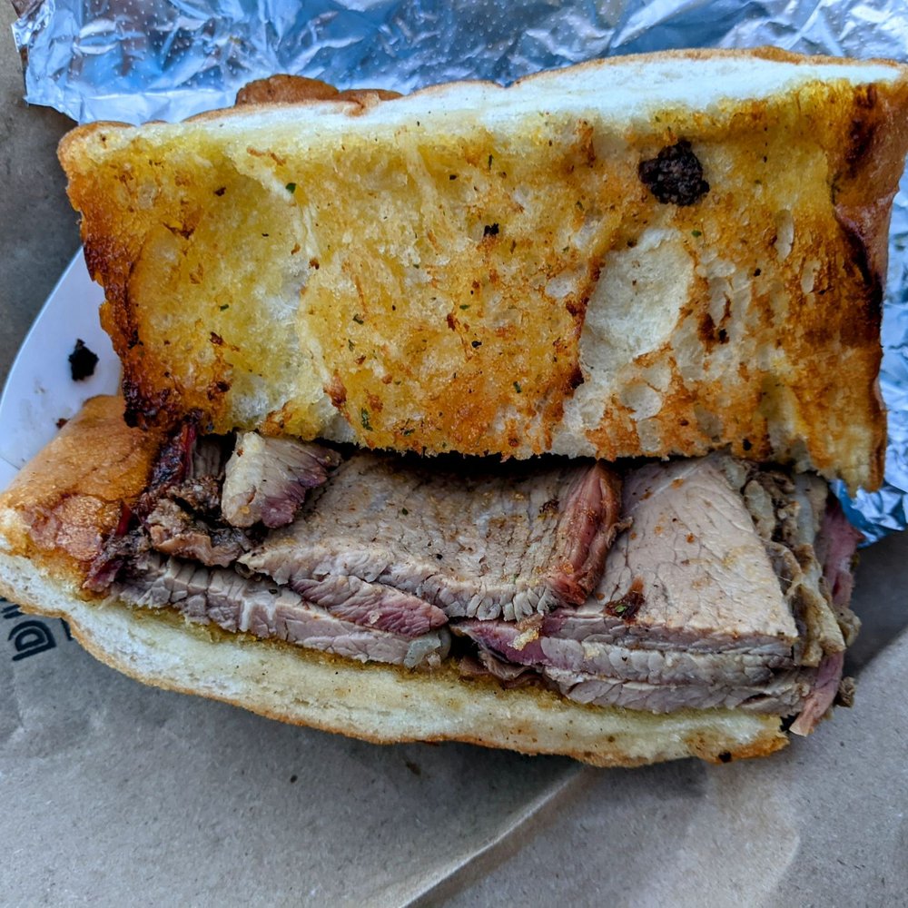 Mansmith's BBQ - a roast beef sandwich - Food Trucks Near Me