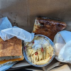 Beagle Bagel - My lunch. The tuna melt with jalapeño peppers added, pasta salad  and a buttermilk cake slice. This place is my favorite.