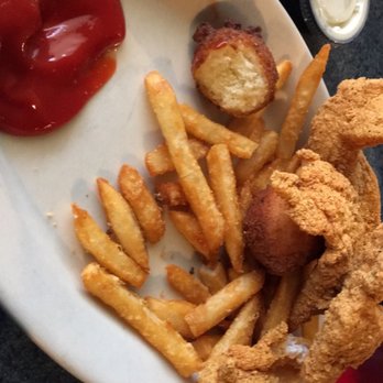 KJ's Restaurant - Fish plate served with fries and two hush puppies. Slaw also but not pictured. - Breakfast & Brunch Near Me - Judsonia, Arkansas
