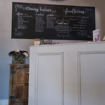 Bare Necessity Wax & Spa - Waiting area w price board - Skin Care Near Me - Gilbert, Arizona