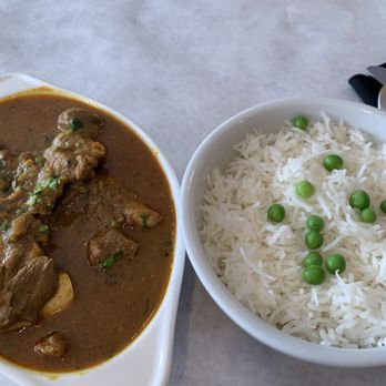 Pranam Restaurant & Bar - Goat curry which came with rice. Plenty of goat chunks throughout and in the bottom. - Indian Near Me - Astoria, New York Pranam Restaurant & Bar - Goat curry which came with rice. Plenty of goat chunks throughout and in the bottom. - Indian Near Me - Astoria, New York