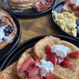 Three French WSausage & Eggs blueberry, vanilla sensation, strawberries&cream  Short stack w bacon  Not pictured: fried chicken wing