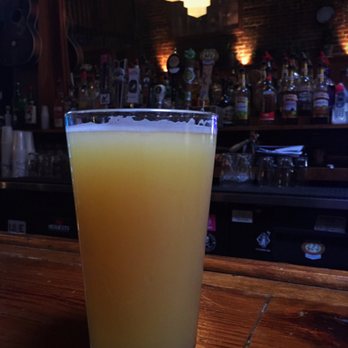 Stillwater Taproom - a glass of orange juice - Beer Bar Near Me - Augusta, Georgia