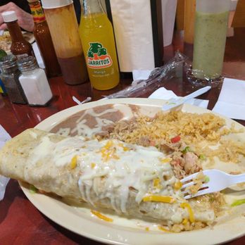 Famous Taco - Husbands GIGANTIC BURRITO !! OMG!!!!! chicken stuffed!!! - Tacos Near Me - Fort Wayne, Indiana