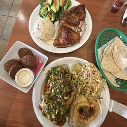1/2 Spicy Lemon Garlic Chicken A La Carte 1/2 Chicken Original Falafel Plate Maison rice Spicy hummus Spicy/sweet coleslaw
