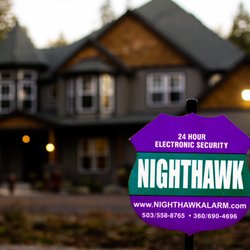 Nighthawk Alarm Services - A yard sign in front of a house