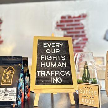 Palate Coffee Roasters - a sign that says every cup fights human trafficking - Coffee & Tea Near Me - Sanford, Florida