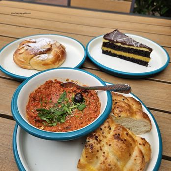 Berna's Bakery & Cafe - Muhammara (red pepper dip), Mango Jelly Roll & Dubai Chocolate Cake - Turkish Near Me - Issaquah, Washington
