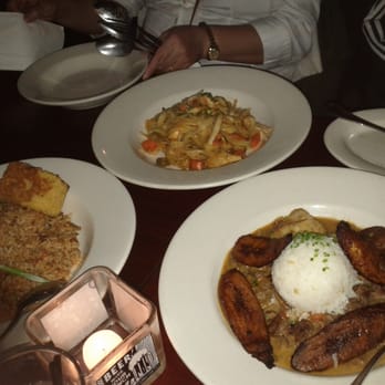 Highland Kitchen - Closest Entree: Curried Goat stew, Middle: Rabbit Fettuccine, Left: Spicy Jambalaya with Duck Confit - New American Near Me - Somerville, Massachusetts