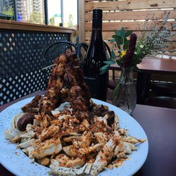 Neos Souvlakeri - Tavla Meat Platter - Pork gyro, chicken gyro, loukaniko, chicken souvlaki, pork souvlaki, bifteki, grilled pita, and tzatziki