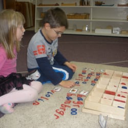 Gateway Montessori School - Building words with a friend.