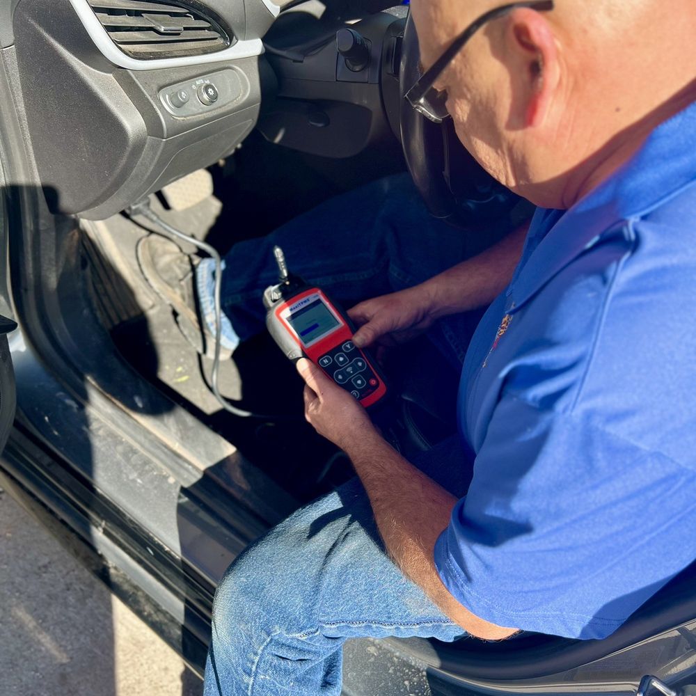Stateline Tire & Wheel - Greg, diagnosing bad tire sensor. - Tires Near Me - Parker, Arizona Stateline Tire & Wheel - Greg, diagnosing bad tire sensor. - Tires Near Me - Parker, Arizona
