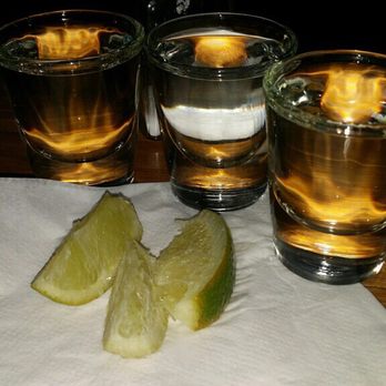 The Partners - three shot glasses with lime slices on a napkin - Bars Near Me - Ridgecrest, California