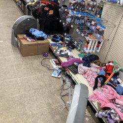 Dollar General - Sloppy. Piles of merchandise, some on floor.
