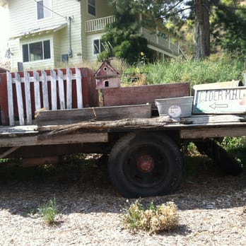 Cashmere Cider Mill - an old red truck with a wooden fence - Cideries Near Me - Cashmere, Washington Cashmere Cider Mill - an old red truck with a wooden fence - Cideries Near Me - Cashmere, Washington
