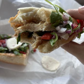 Stasio's - Cross section of the Chicken Cutlet sandwich. - Italian Near Me - Orlando, Florida Stasio's - Cross section of the Chicken Cutlet sandwich. - Italian Near Me - Orlando, Florida