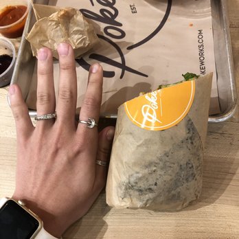 Pokeworks - burrito size in reference to my hand! HUGE - Hawaiian Near Me - Oviedo, Florida
