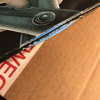 FYE - Both albums protruding through the bottom of the cover. - Music & DVDs Near Me - Montebello, California